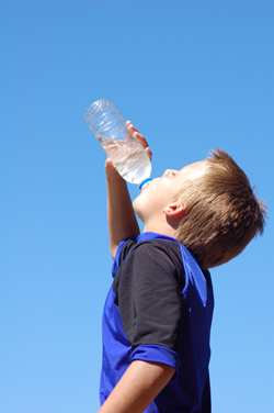 Boy drinking a bottle of water