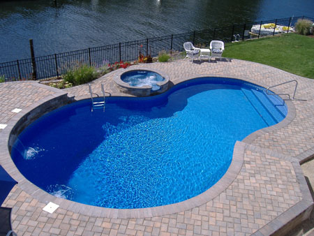 Backyard pool next to river