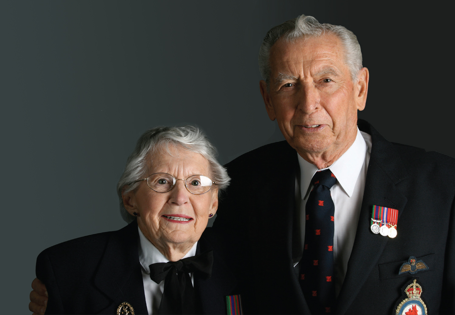 male and female veterans with medals