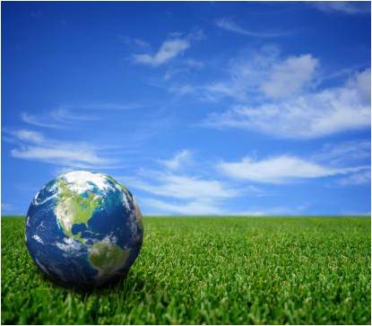 Globe in grass with blue skies