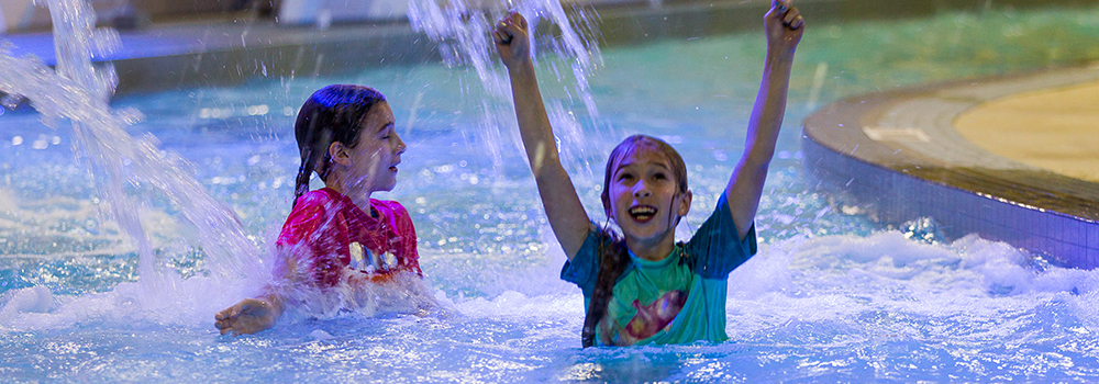 Children swim at Adventure Bay Family Water Park Presented by WFCU Credit Union