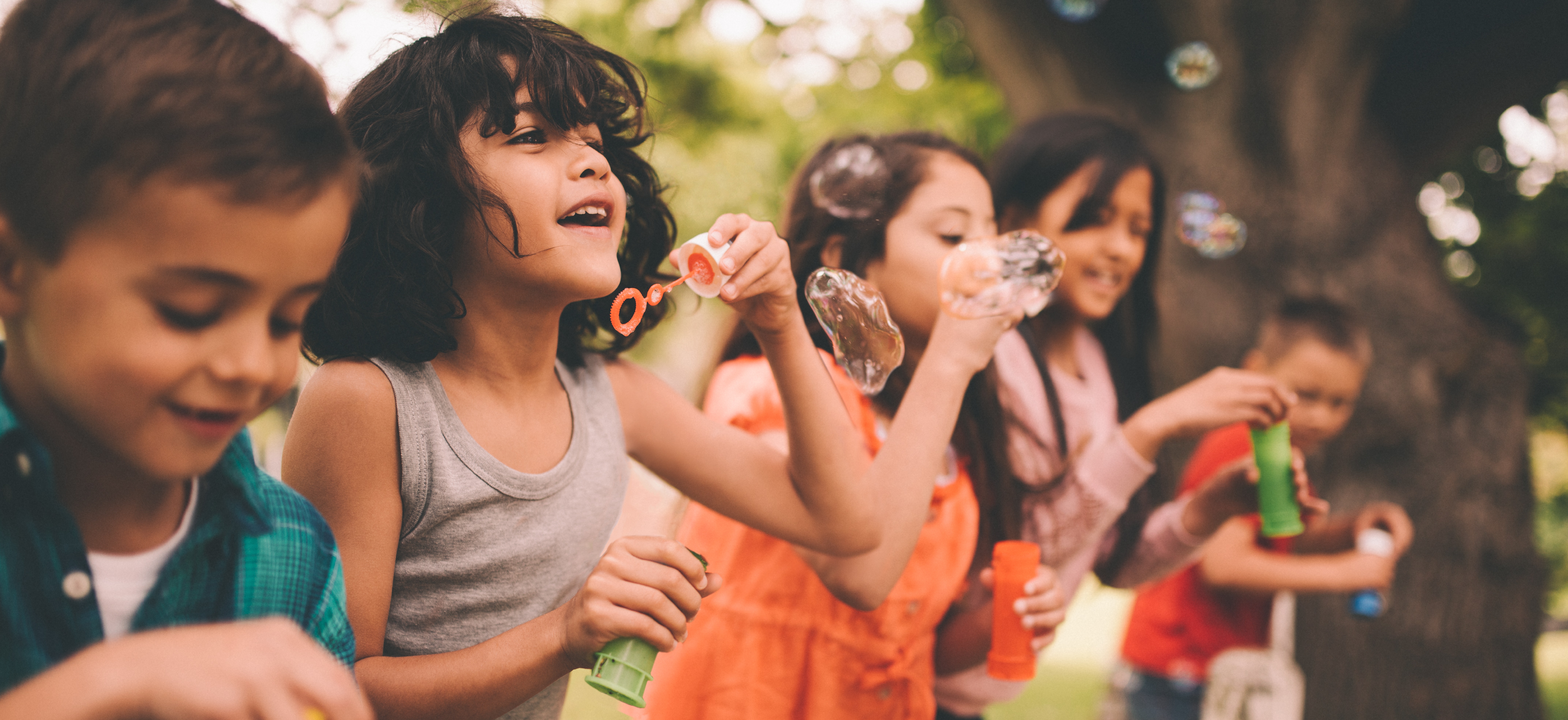 Children blowing bubbles