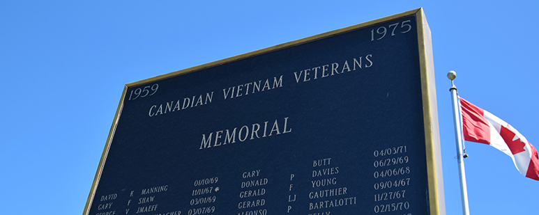 Detail of a memorial list etched into granite.