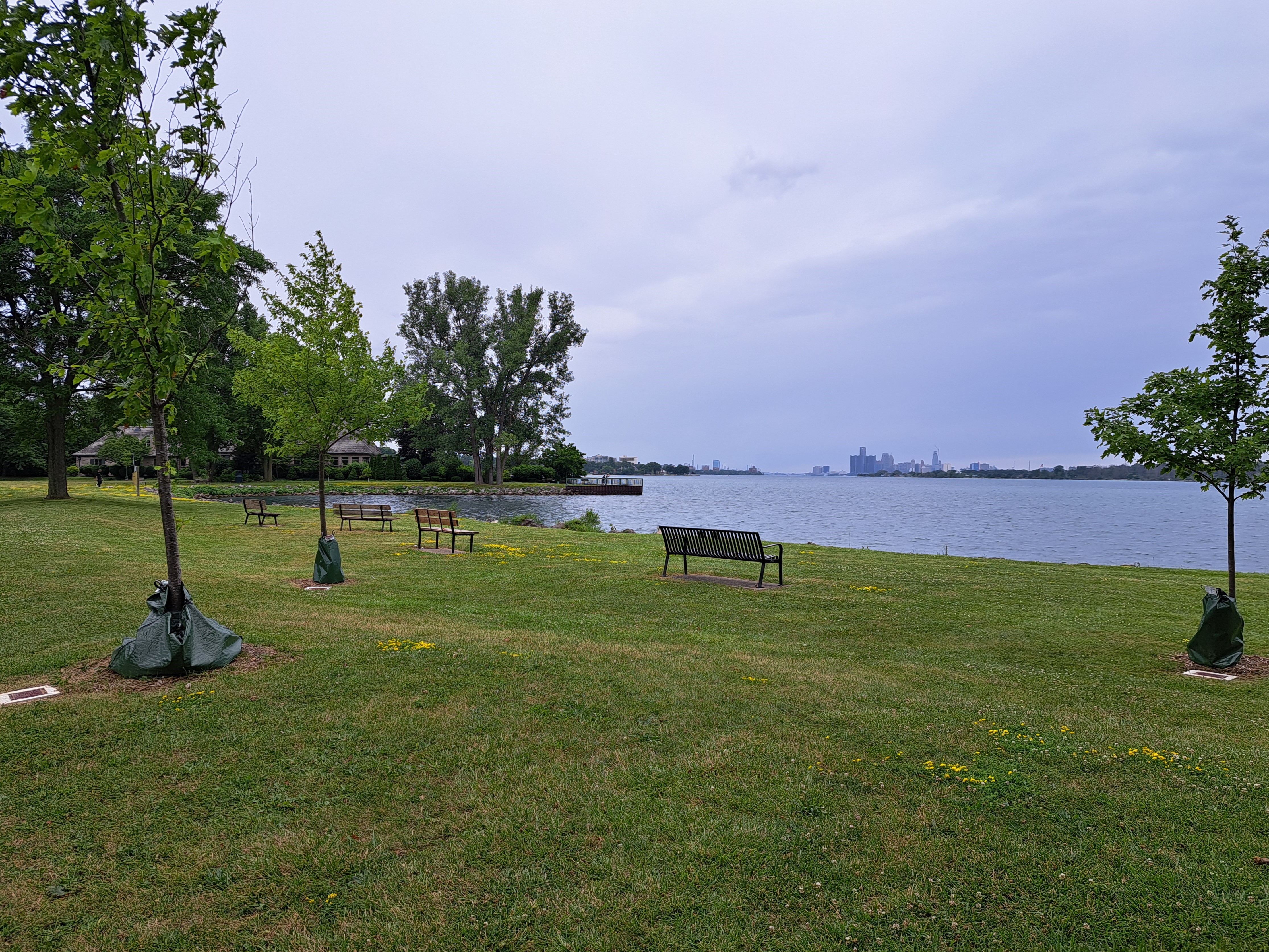 Bridges Bay Park Trees and benches alongside Detroit River