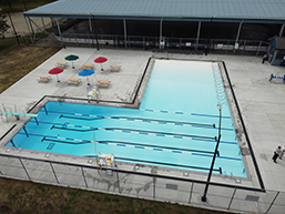 Aerial view of Lanspeary Pool and adjacent seating area with umbrellas